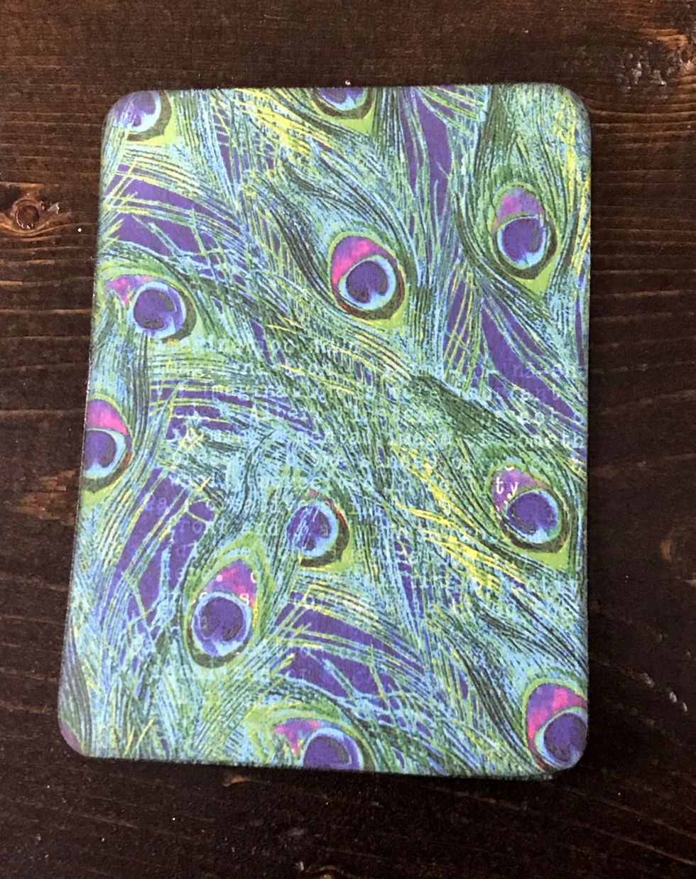 From the Kaleidoscope paper, cut a piece that measures 3 1/2" x 4 3/8". Round all four corners. Distress edges. Ink the edges using black ink.