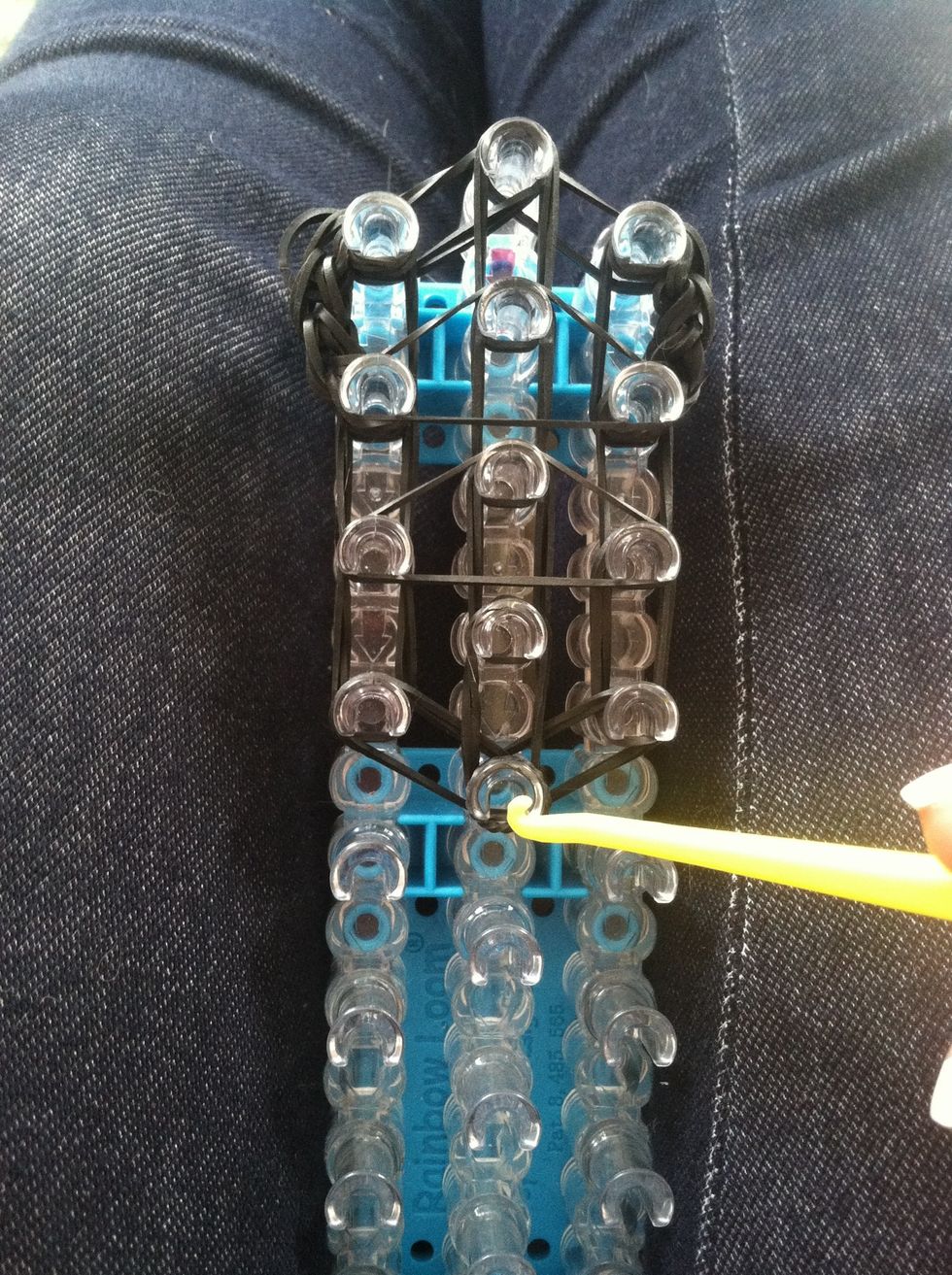 From the middle peg we're going to start looping up. Just like normal