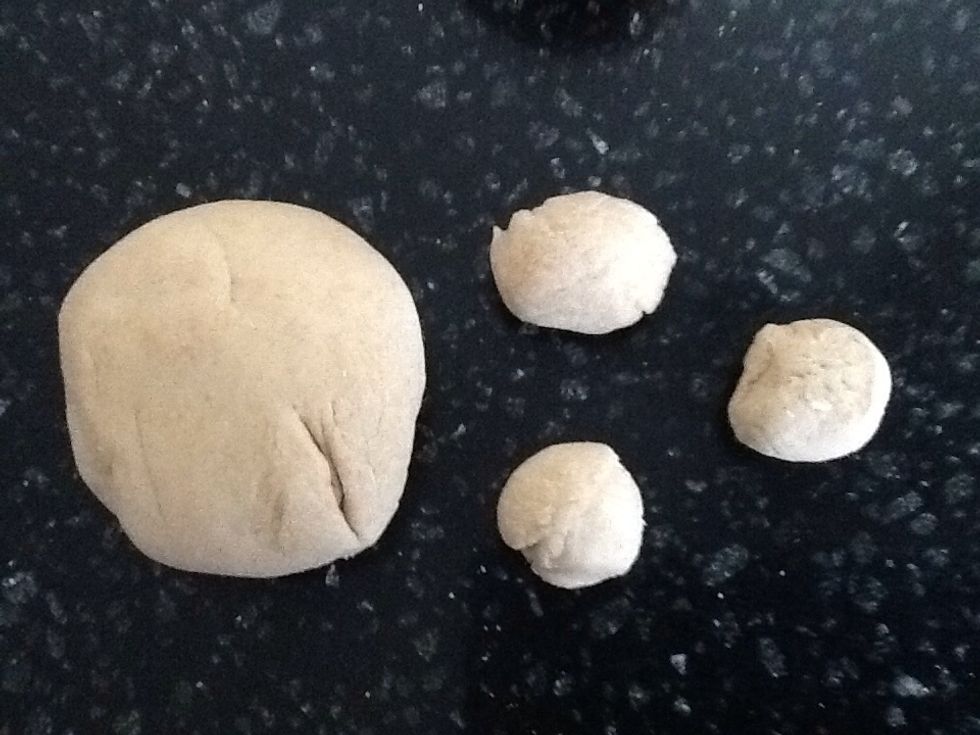 From the piece designated for the head, pinch off three pieces to form ears and snout.