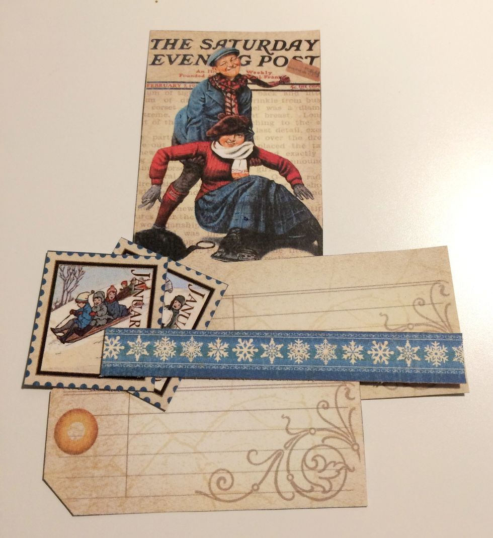 From the Place in Time - January Cut Aparts, cut out two stamps, two tags, the Saturday Post image and the snowflake border. Cut the border to 3 5/8".