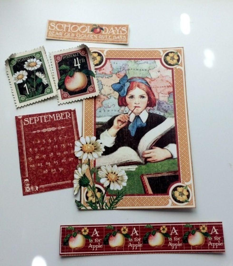 From the September Collective paper, cut out: the Apple border, September Calendar, School Days sentiment, Girl sitting at desk, and two postage stamps.
