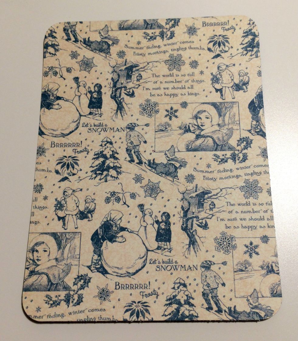 From the solids and patterns pad, take out the winter patterned paper. From the paper, cut out a piece that measures 3 3/8" x 4 1/2". Round all four corners of the paper.