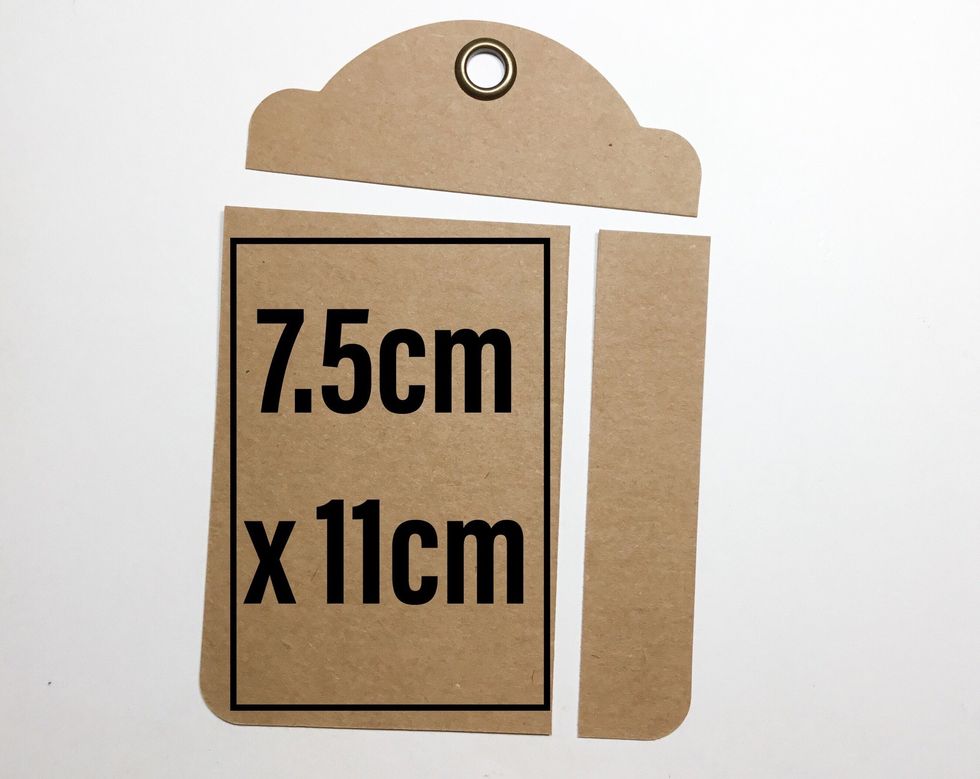From the tag cut a 7.5cm x 11cm piece as shown. You will need to do this to both of the tags. Using a corner punch, round the corners of both pieces.