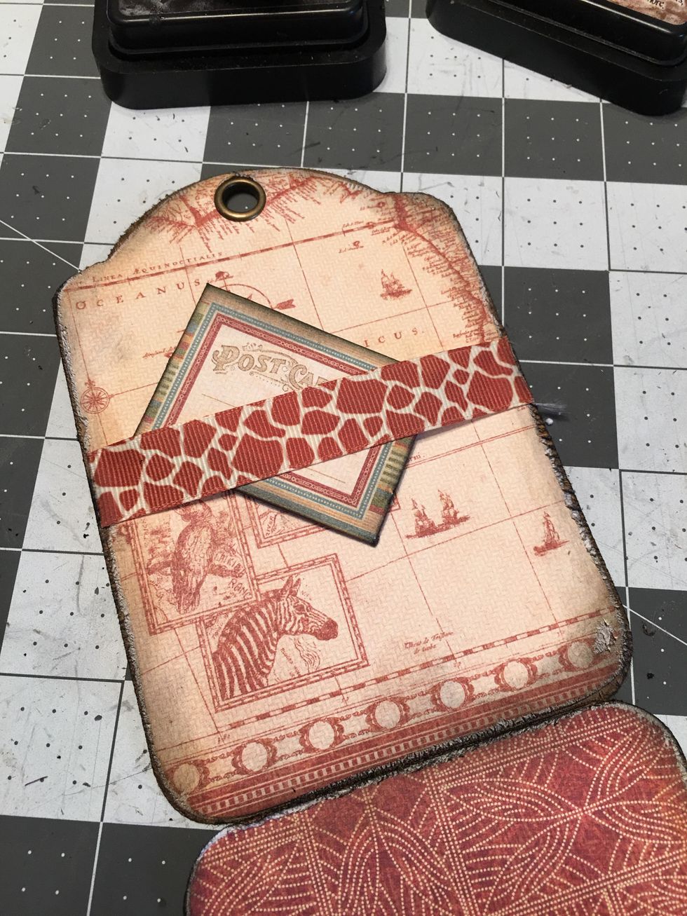 From the Tags & Pockets set, punch out a small postcard envelope , fold, ink and insert behind the ribbon belly band. You can also mat photos to black cardstock and insert them behind the belly band.