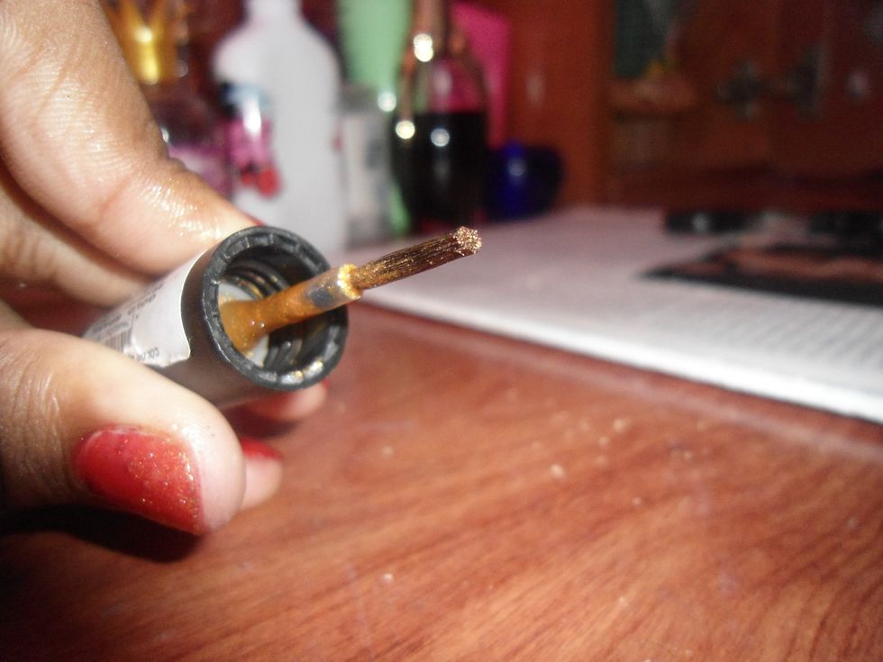 from the tip of the gold polish brush....