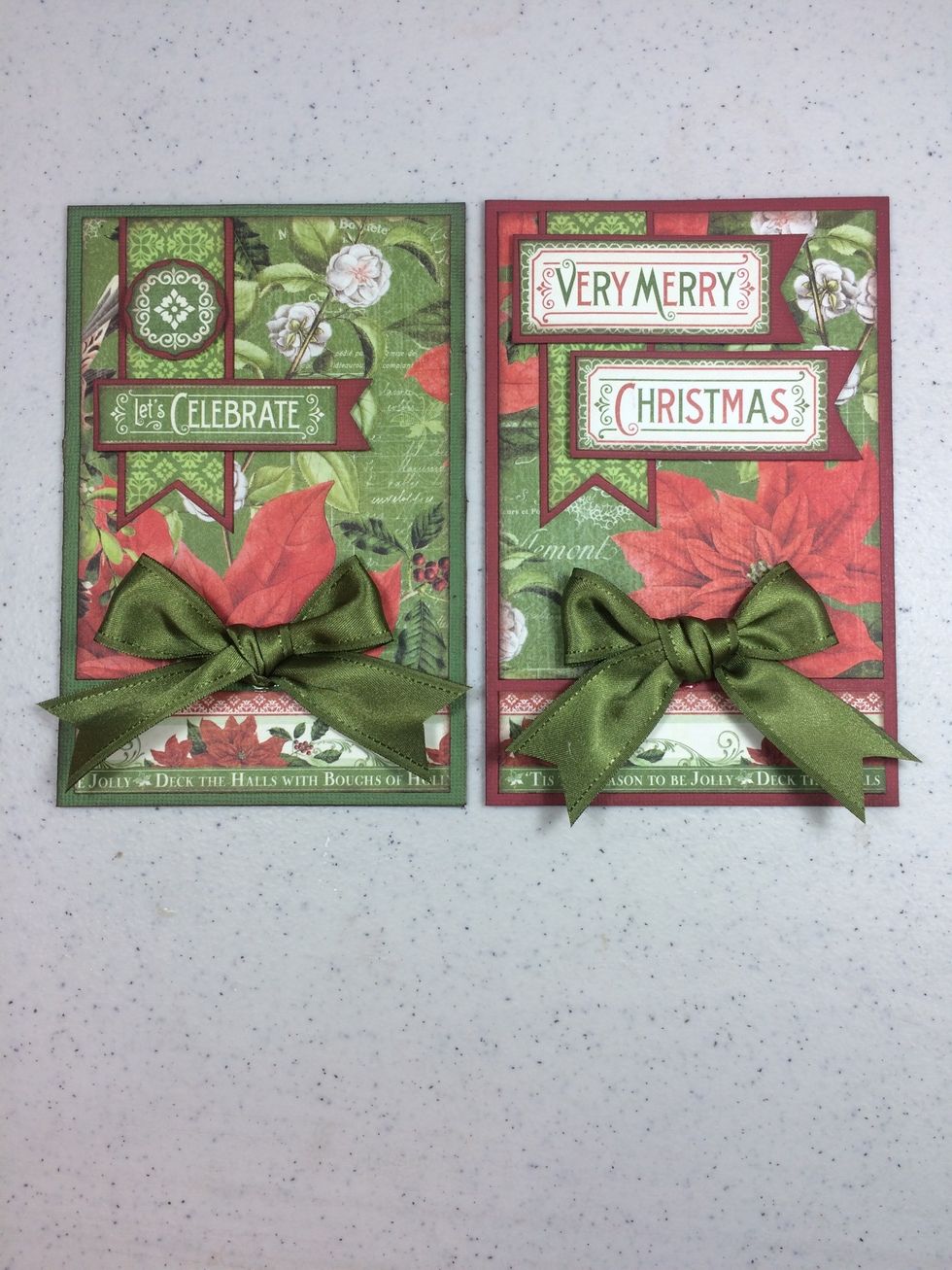 From two 14" lengths of green satin ribbon, tie a fluffy bow and adhere to card fronts with fabric glue. Done!