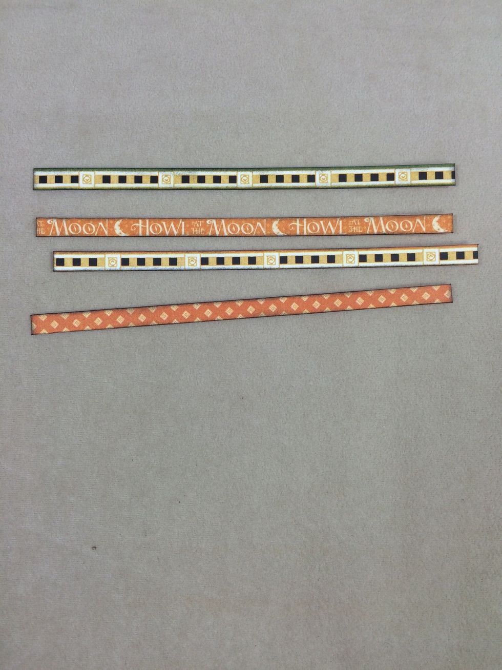 From Wicked Whimsey, cut four strips at 1/4" x 5" each. Ink edges.