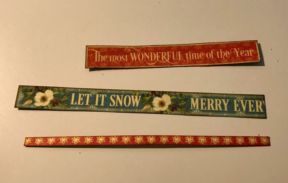 From Winter Collective Paper, cut Let & Snowflake borders & the most banner out. Cut snowflake border to 4 1/2" & let border to 4 1/4". Distress edges. Ink edges of pieces with Dark Cashmere Ink.