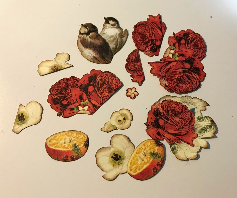 From Winter Paper, fussy cut 4 red roses, 1 small white flower, 1 orange, 1 red rose/white flower, 3 small white flowers, 2 birds & 1 orange/white flower. Ink edges of images using Dark Cashmere Ink.