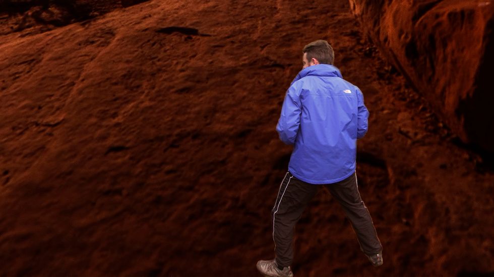 From your stance, prepare to swing the rear leg forwards and up.