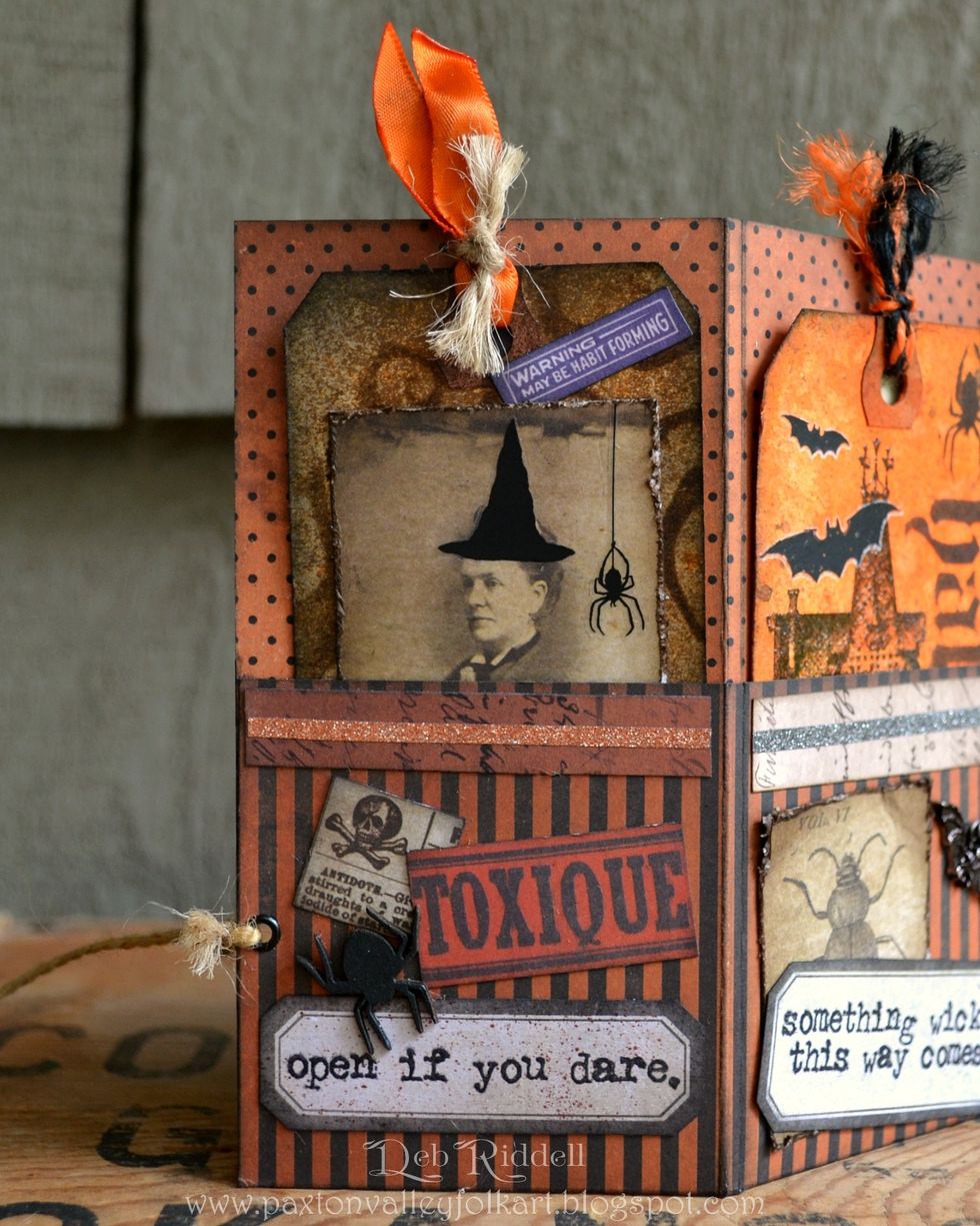 Front pocket page - cut a strip from Regions Beyond paper, layer a narrow strip of Halloween Deco sheet on top and adhere to the top of the pocket. Layer images from the Frightful Ephemera pack.