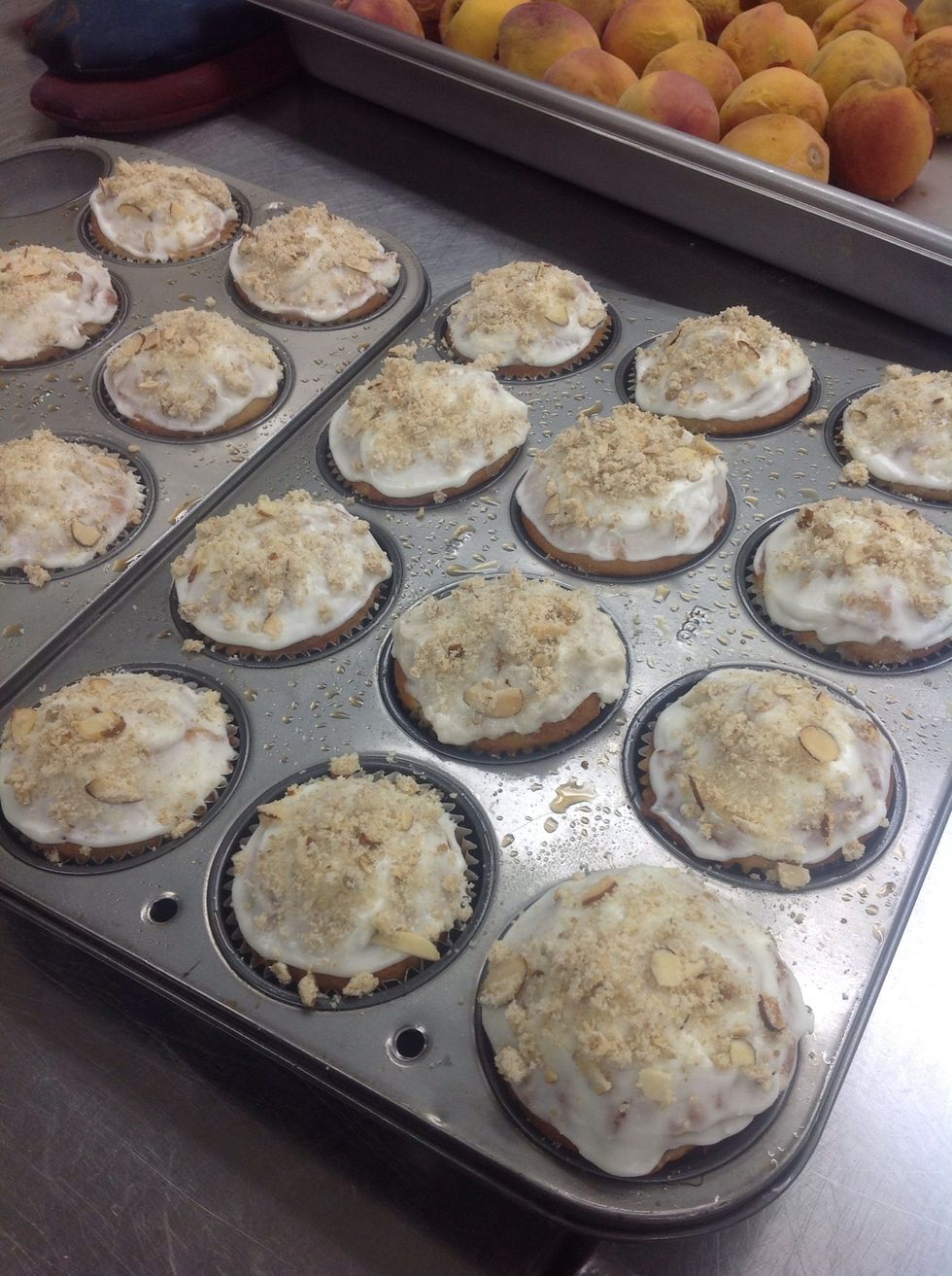 Frost cooled cupcakes and sprinkle on the crumble topping
