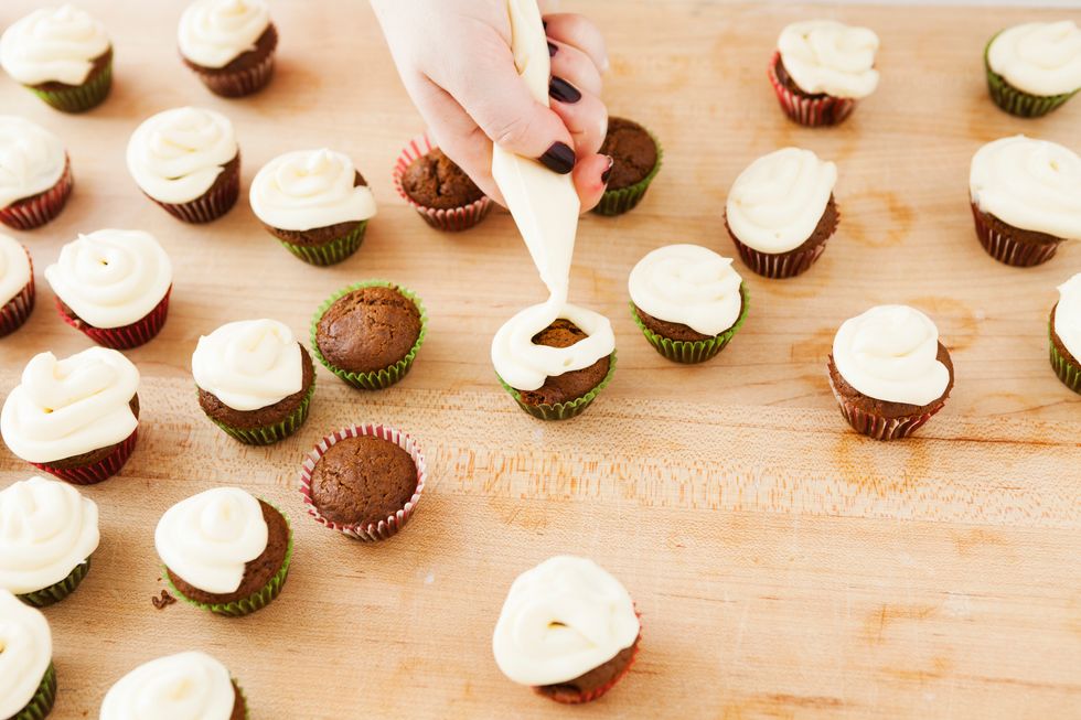 Frost cupcakes right before serving. We used a piping bag filled with frosting and frosted from the outside to the inside.
