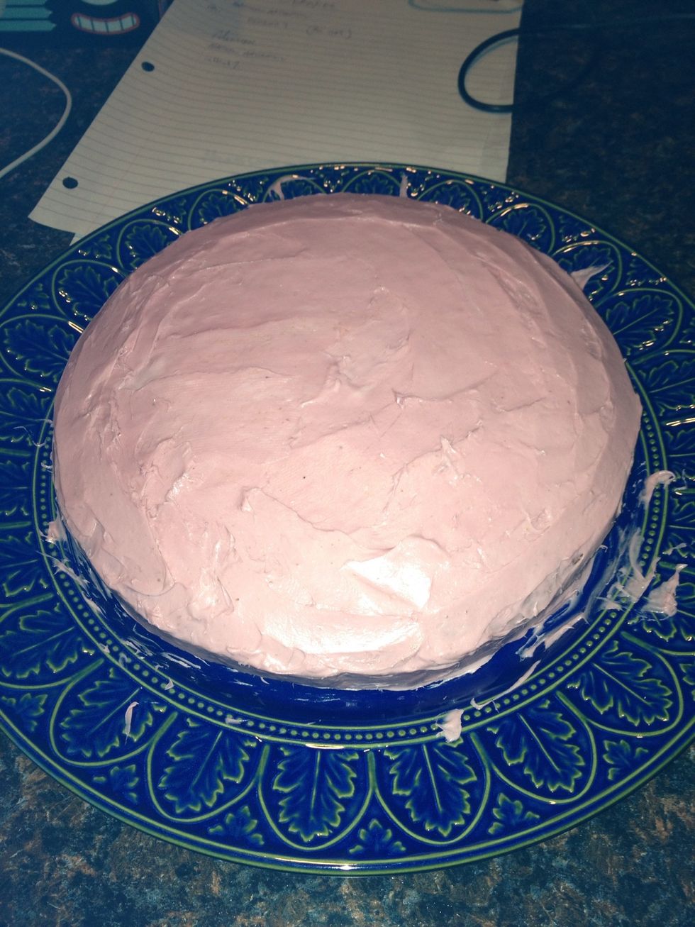 Frost round cake a brown or pale color to be sand or dirt. You can add crumbled cookie crumbs on top of cake if you wish.