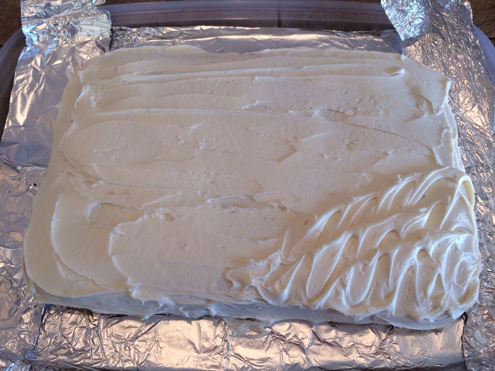 Frost the base cake, making some "waves" in one corner. I used cream cheese frosting.
