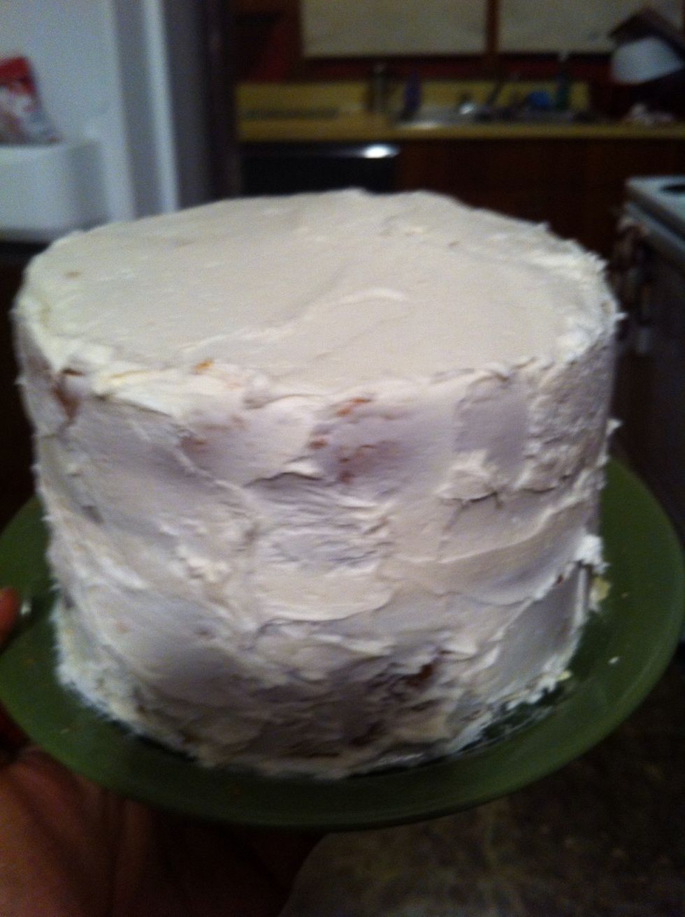 Frost the cake as normal. It doesn't have to be extremely neat because you're covering it with fondant.