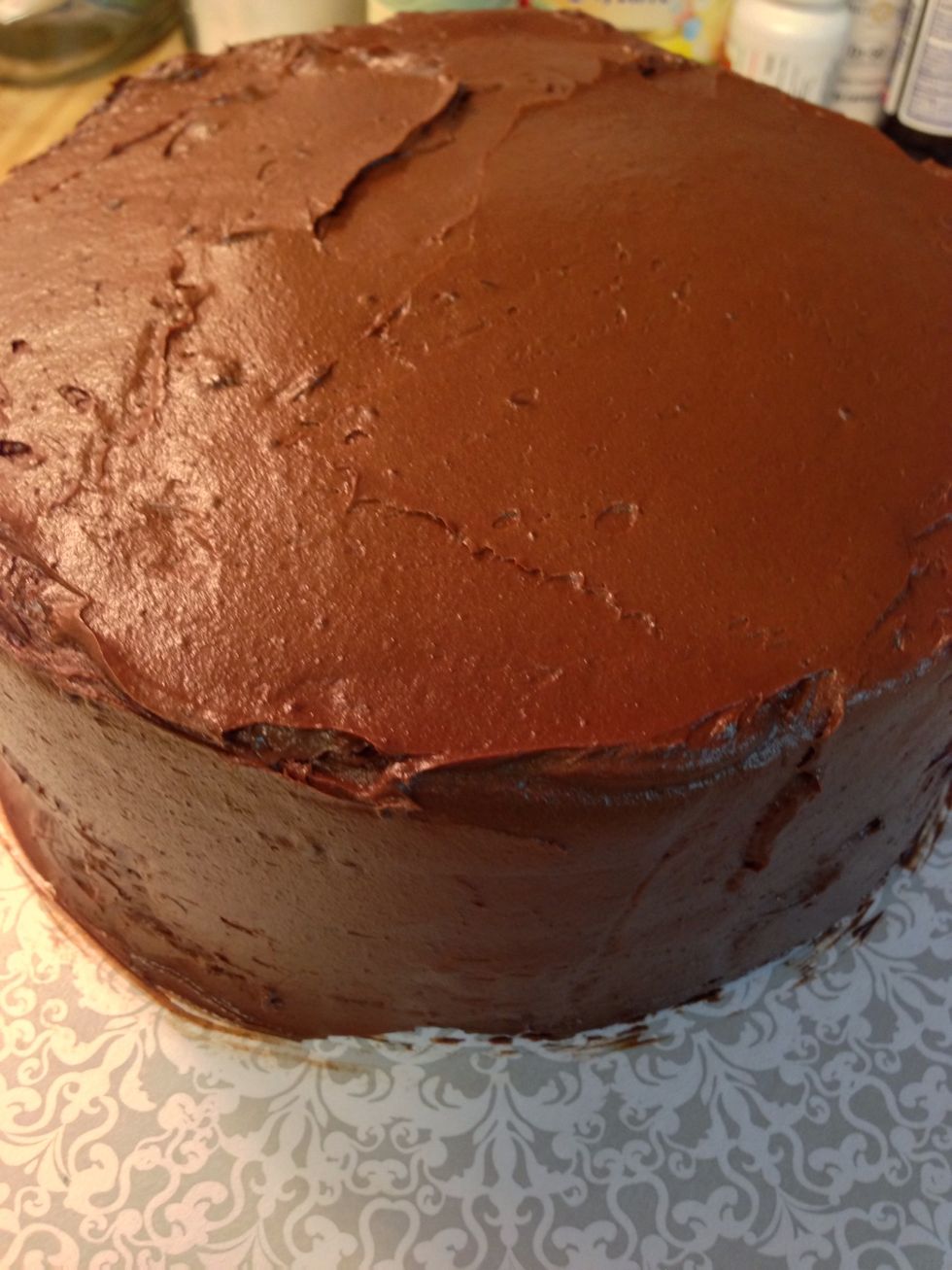 Frost the entire cake with chocolate frosting.