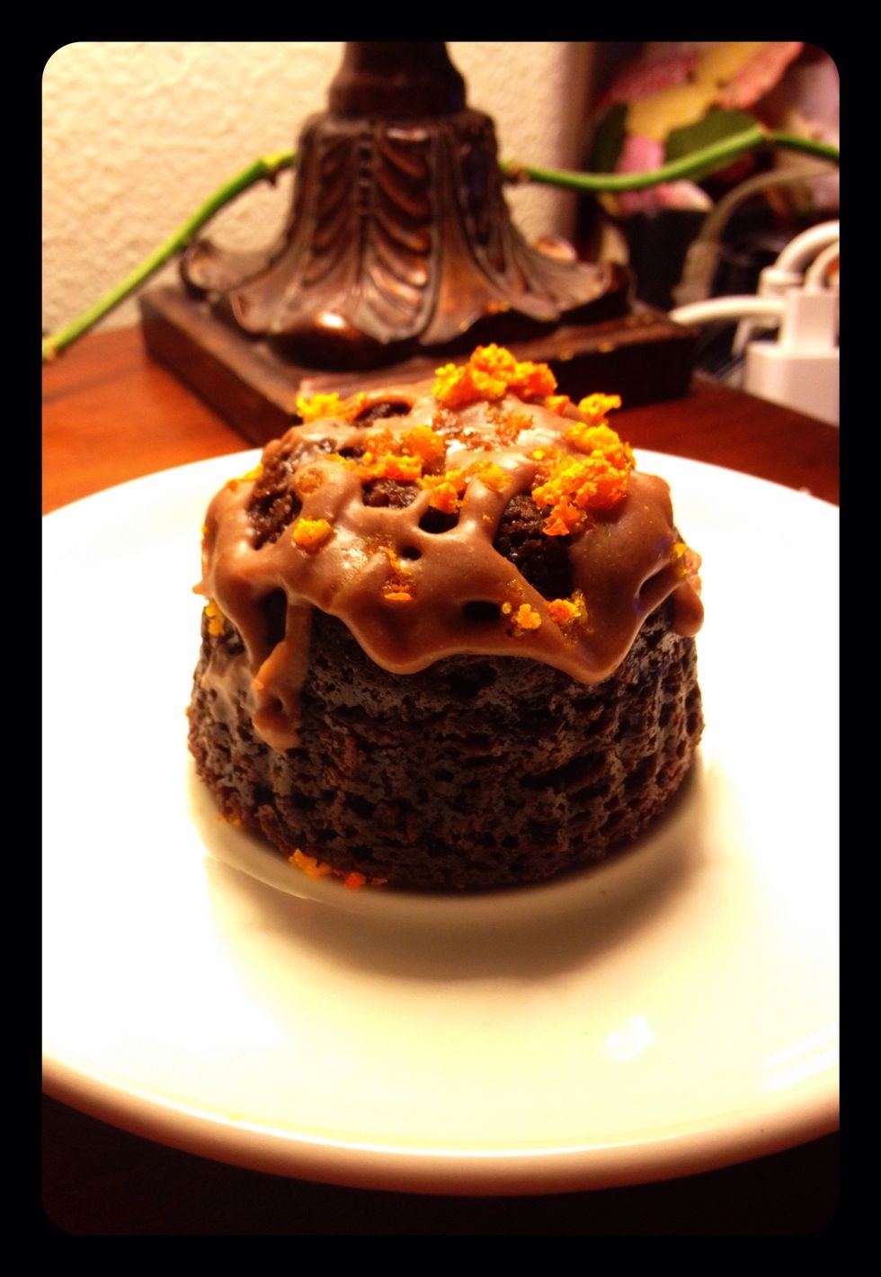Frost your cooled cupcake and sprinkle orange zest on top.