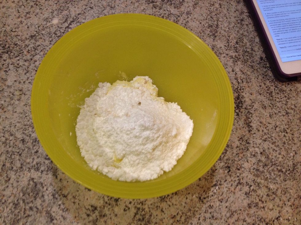 Frosting for the blueberry muffins: add icing sugar, butter and vanilla extract to a bowl