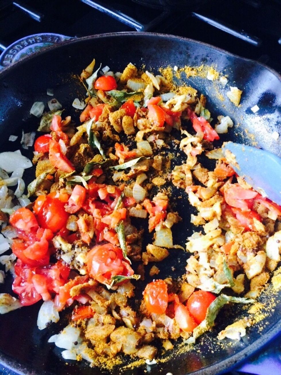 Fry and add one chopped tomato