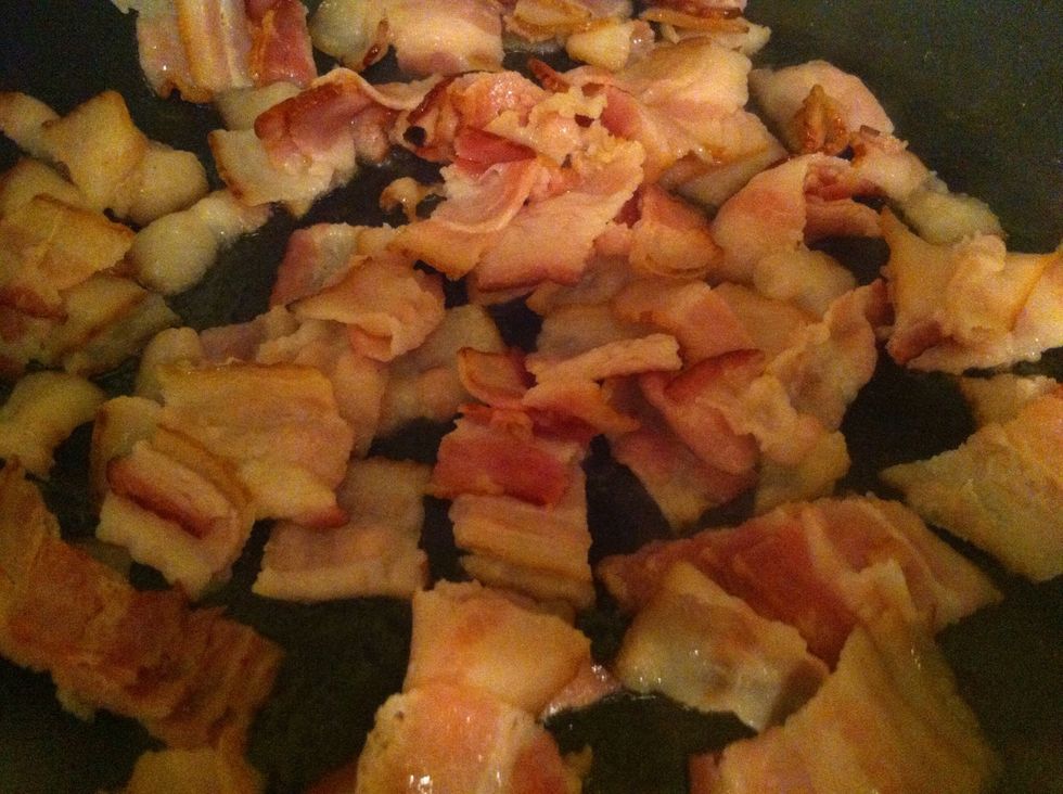 Fry bacon in preheated pan; don't overcook as you will be putting in oven with potatoes