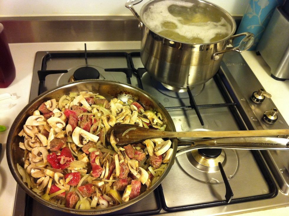 Fry beef, mushroom & onion until meat is sealed. Keep an eye on your potatoes!