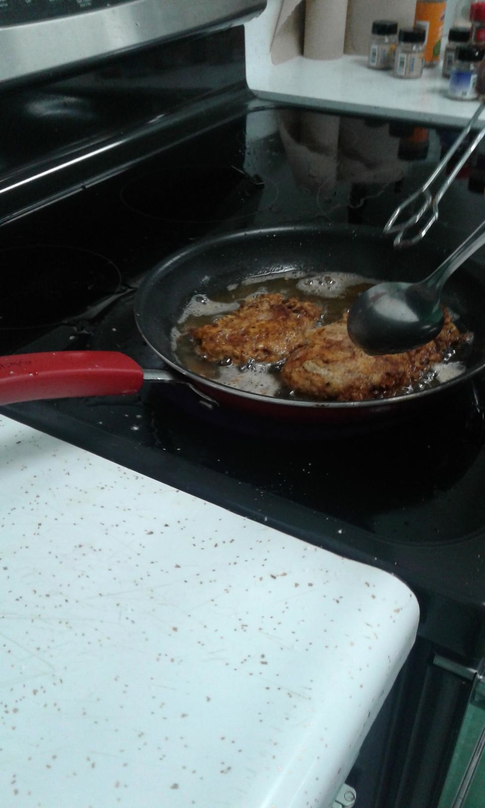 fry chicken, turn with tongs about every 1-2 minutes adjust heat to maintain a temperature of about 300- 325 degrees, insert thermometer in thickest part of the chicken. it has to register 165 degrees