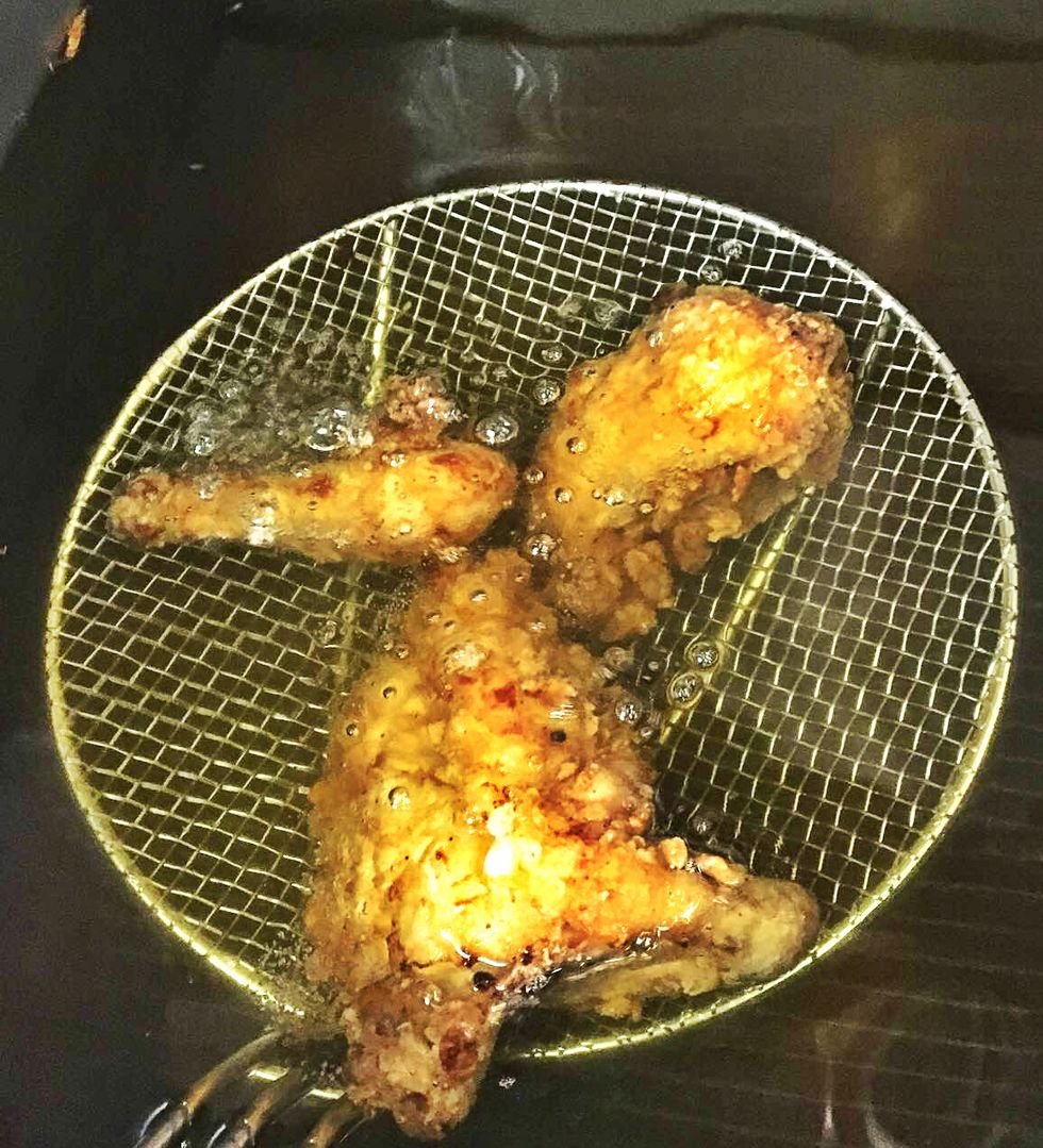 Fry chicken until golden brown.