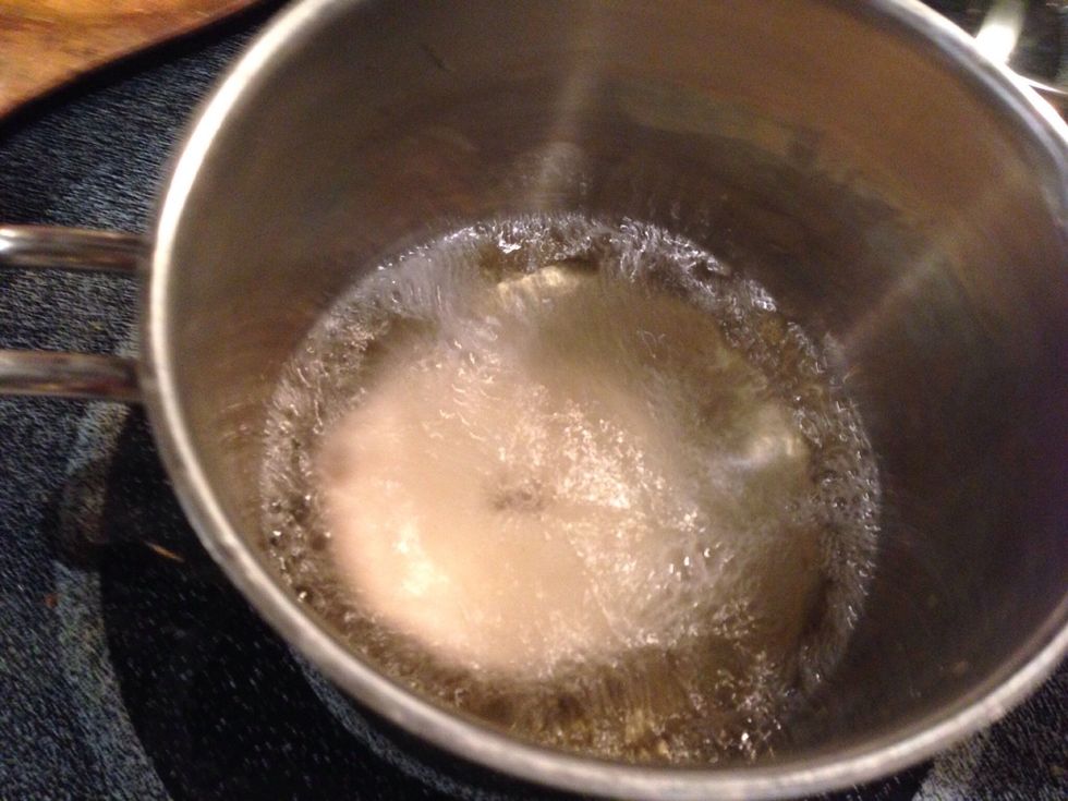 Fry donut on one side 20 to 30 seconds, then flip over with a fork.