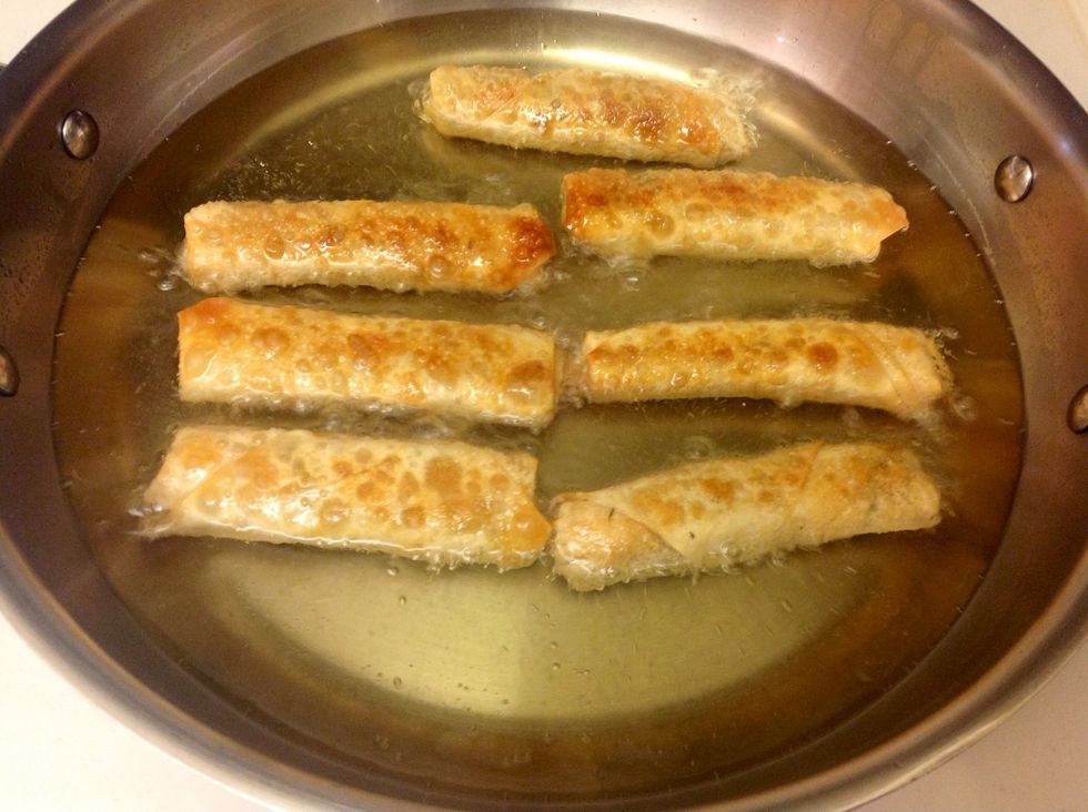 Fry egg rolls for approximately 3 minutes on each side or until you reach desired crispness. When they look golden brown like this there usually perfect for serving!