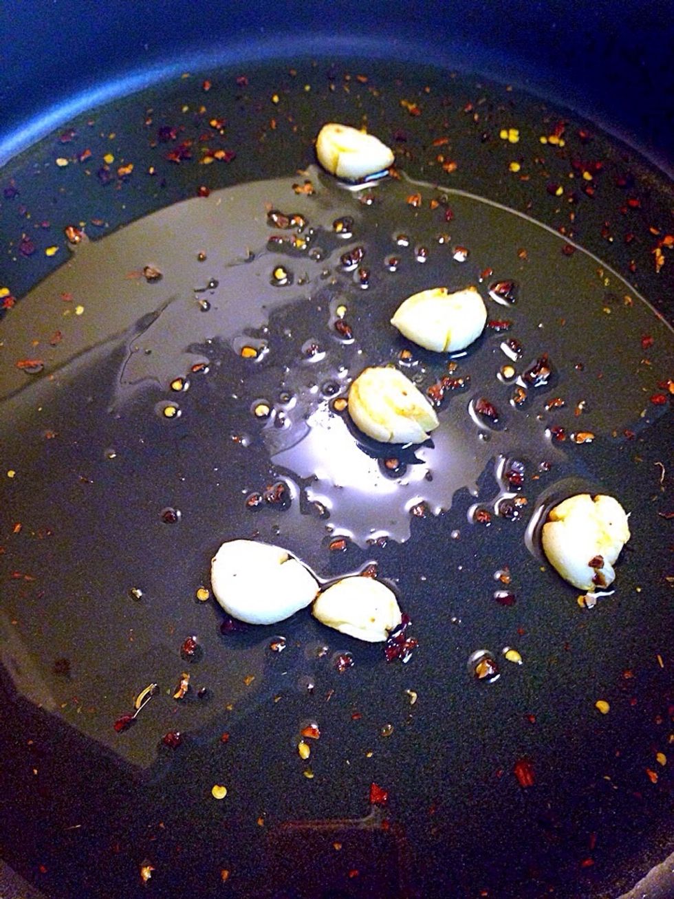 Fry garlic in olive oil till it just golden. Be careful garlic burns quickly. Sprinkle some chili flakes in last minute