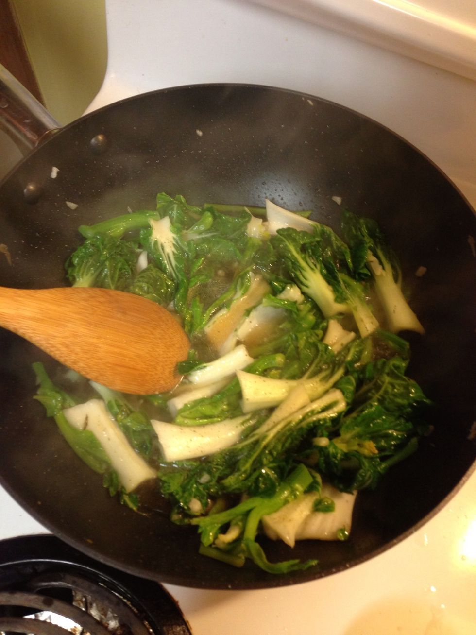 Fry garlic quickly then add bok choy and cook for a few minutes. Add water, soy sauce, and hoisin sauce. Let simmer for a few mins.
