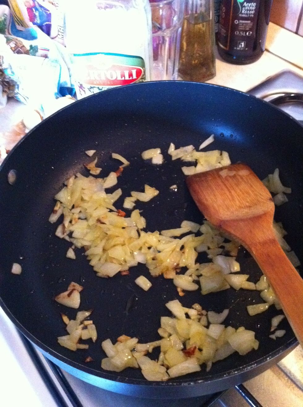 Fry onion, chili peppers and anchovies with extra-virgin olive oil until the onion is golden