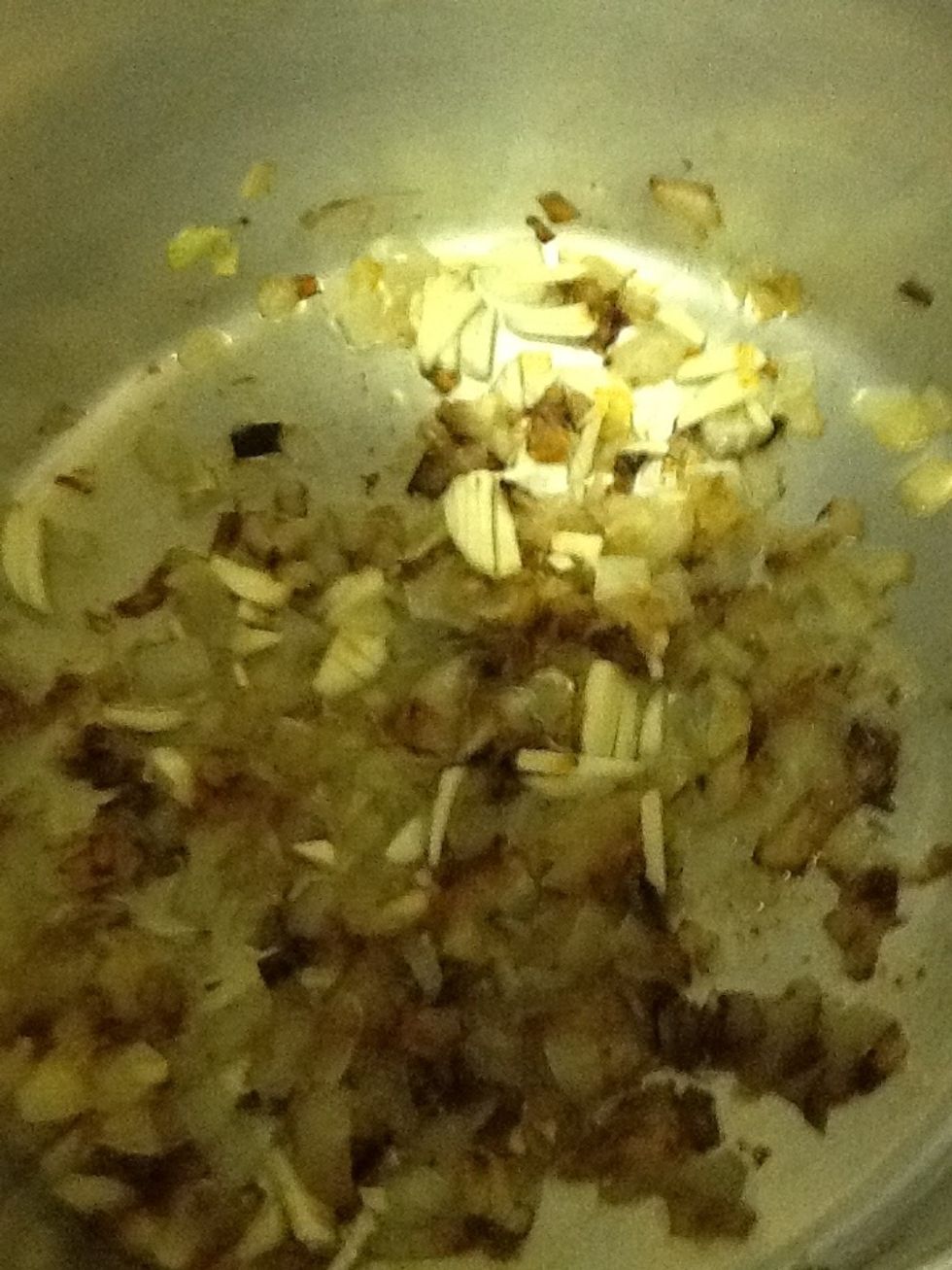 Fry onion until slightly brown. Add garlic and ginger ( freshly chopped ). Stir till further brown.