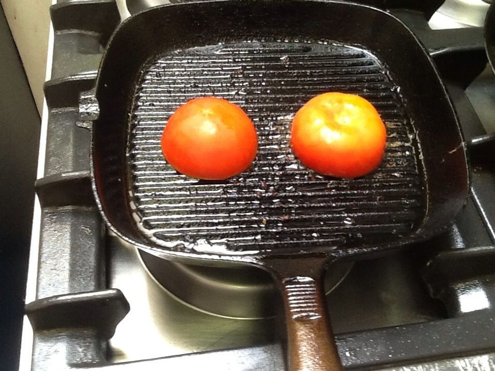 Fry only the tops of the tomatoes then put cheese on the top and melt it