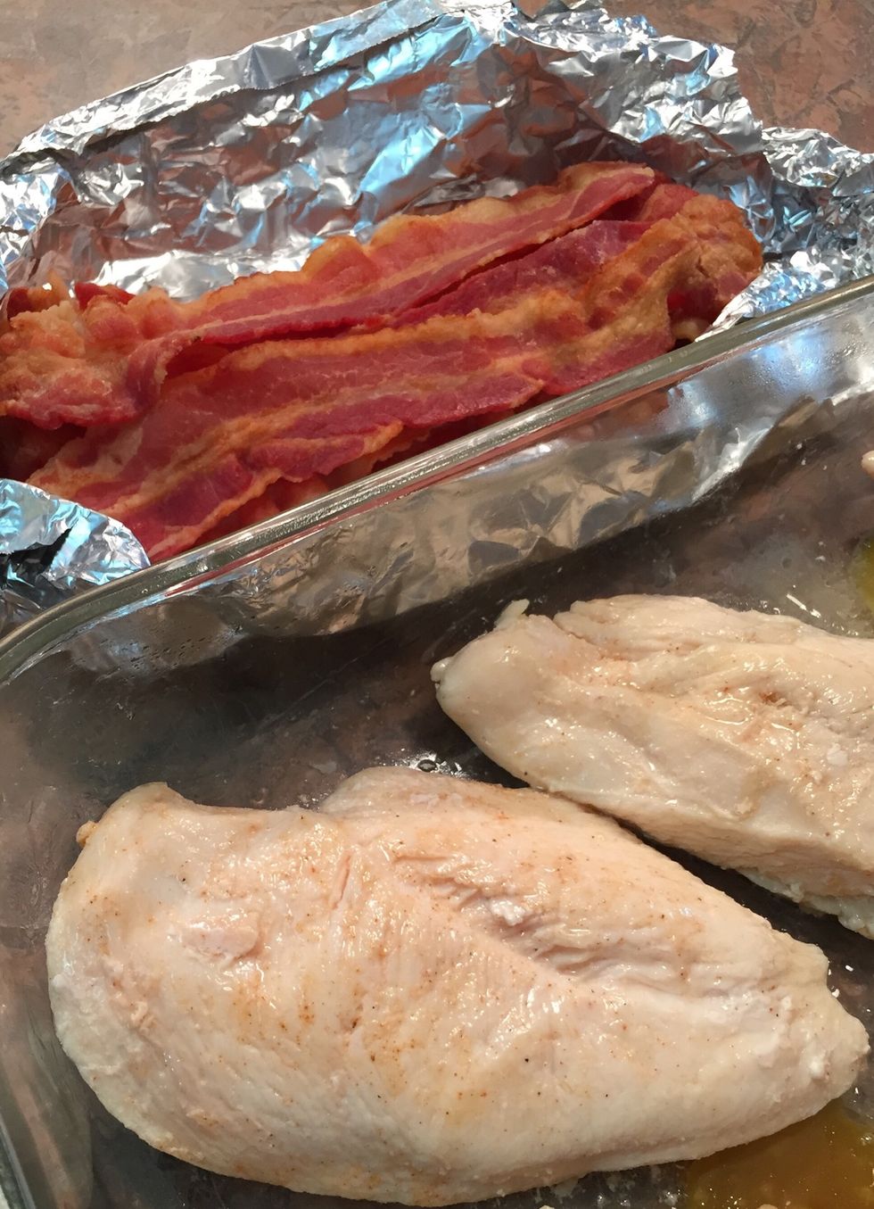 Fry or bake 2 slices bacon per breast. Don't get too crispy. Bacon should still be flexible. Can be done ahead and refrigerated. (I bake 400\u00b0 10 minutes on parchment paper / cookie sheet.