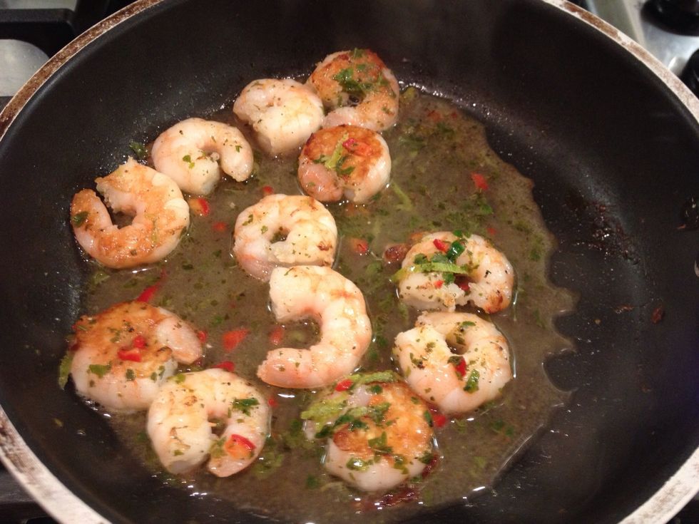 Fry some large prawns (preferably raw ones) in a little oil until they are just hot through. Don't do them for too long else they'll be tough. Add the dressing