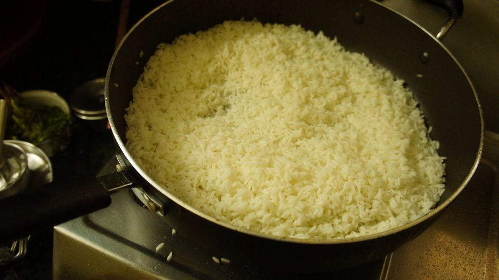 Fry the 70% boiled rice for 2 min..