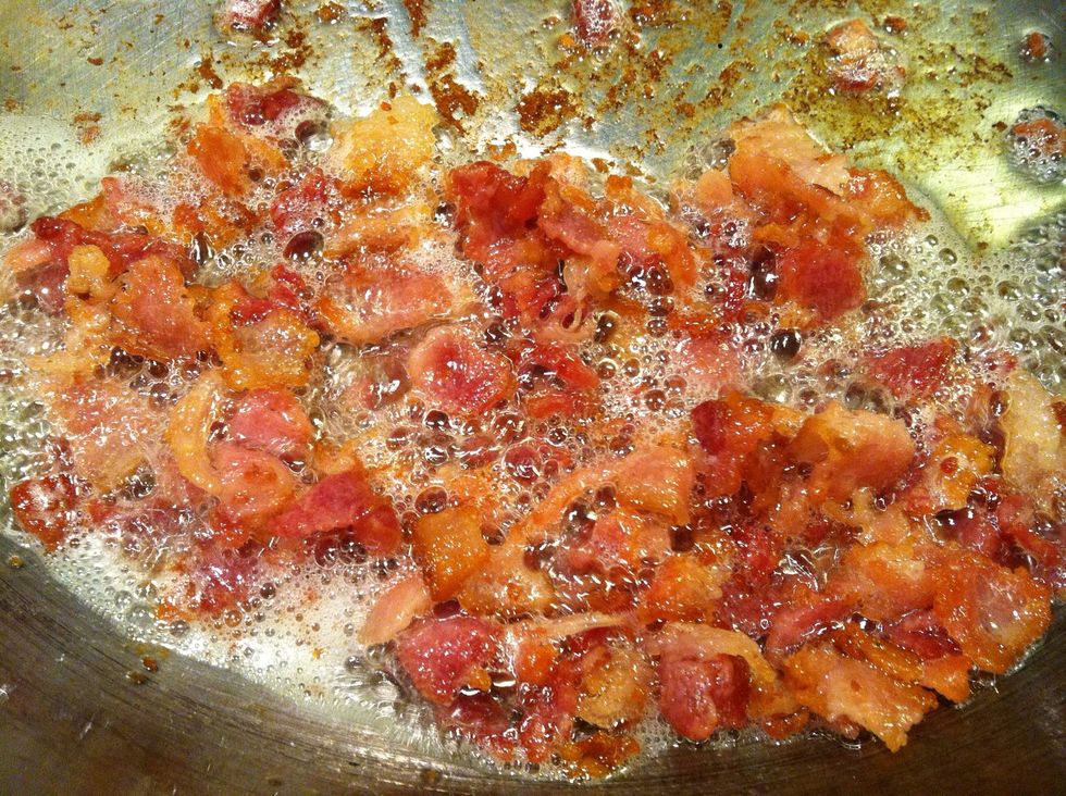 Fry the bacon until they become crispy.