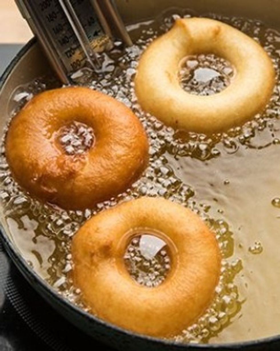 Fry the donuts until there golden on each side