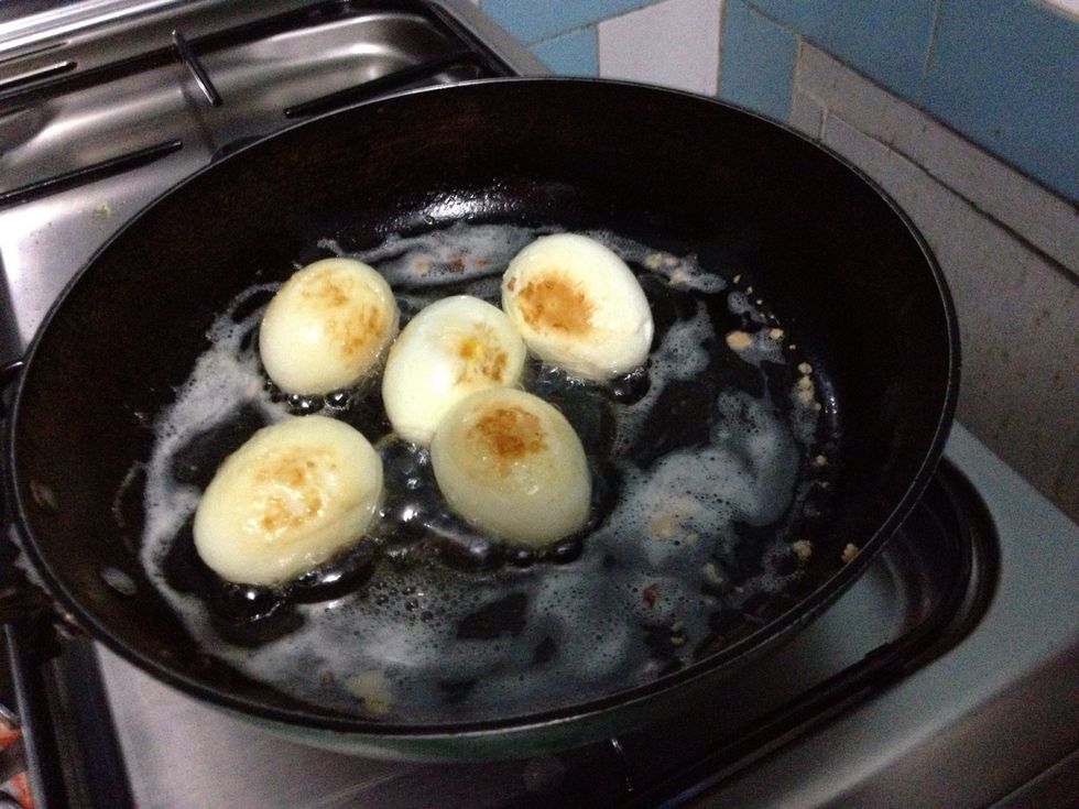Fry the eggs on each side until golden brown. Note: be careful, coz there might be small 'explosion' from the eggs. When you happy with the colors, turn off the heat.
