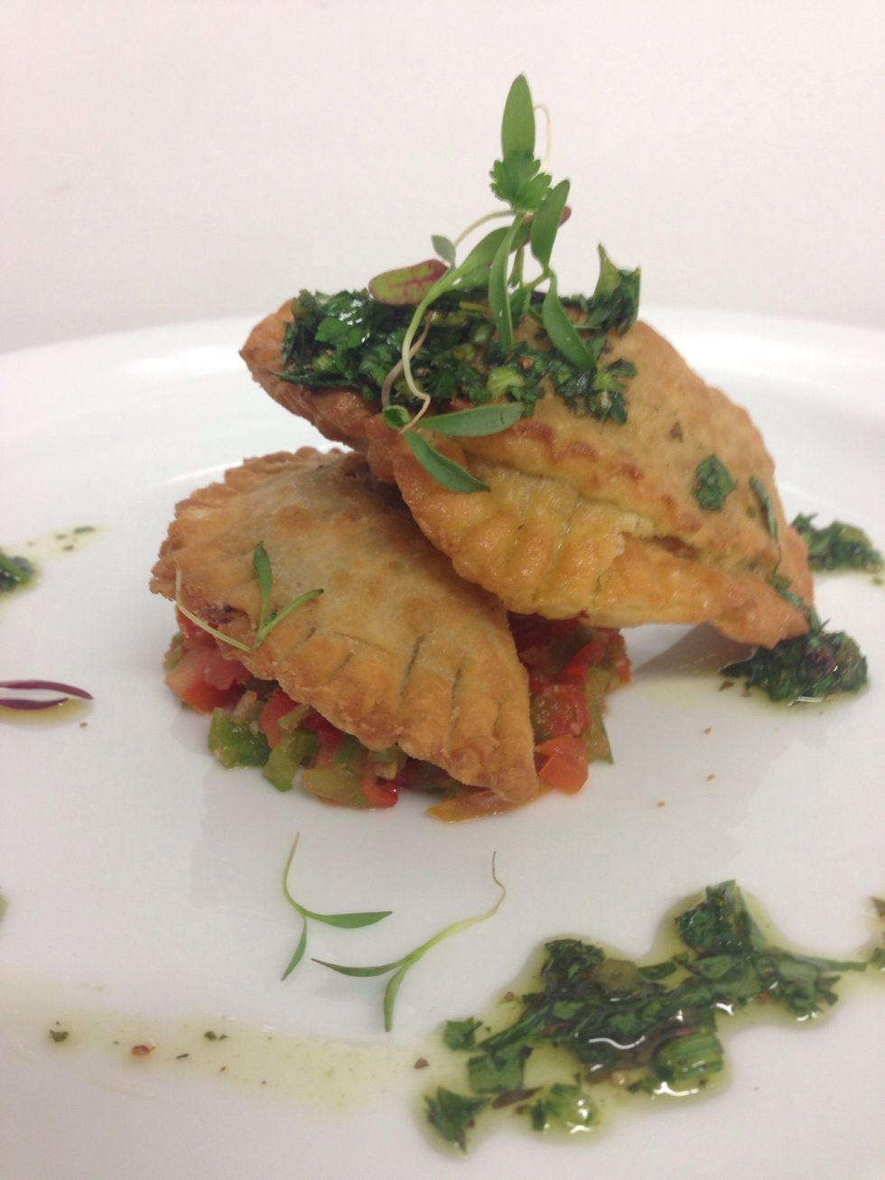 Fry the empanadas, put a bed of pico and place the empanadas on top, spread chimichurry on top and bon apetit