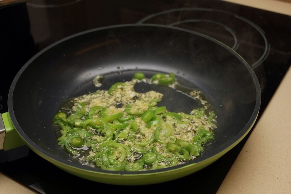 Fry the hot peppers and garlic in olive oil