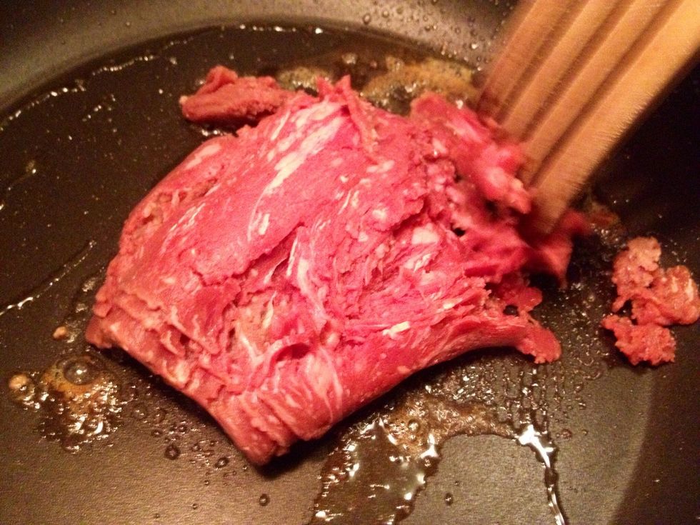 Fry the meat. It comes in one large chunk but after stirring it "acts" like regular minced meat.