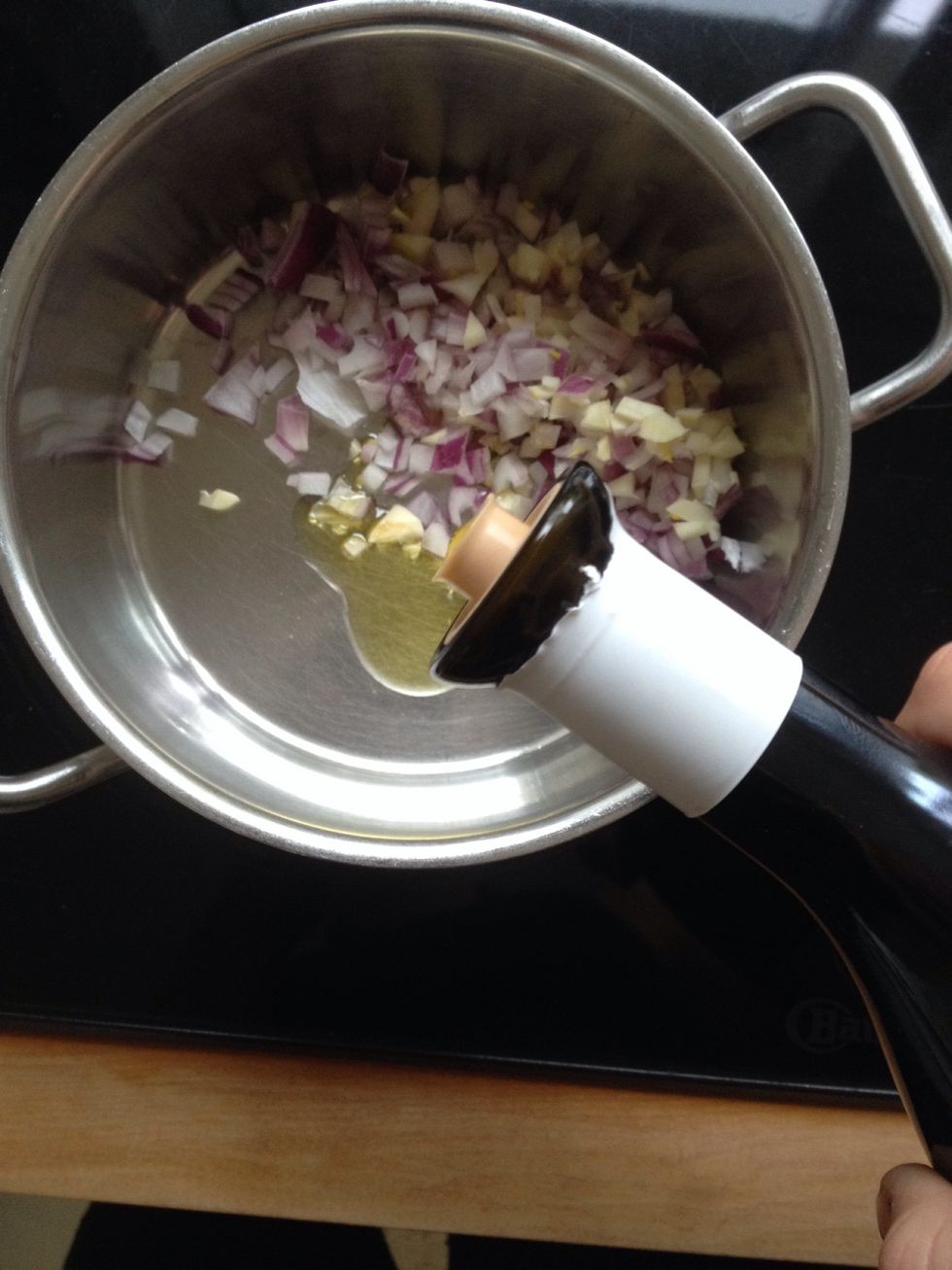 Fry the onion and the garlic with a little bit olive oil in a pot.