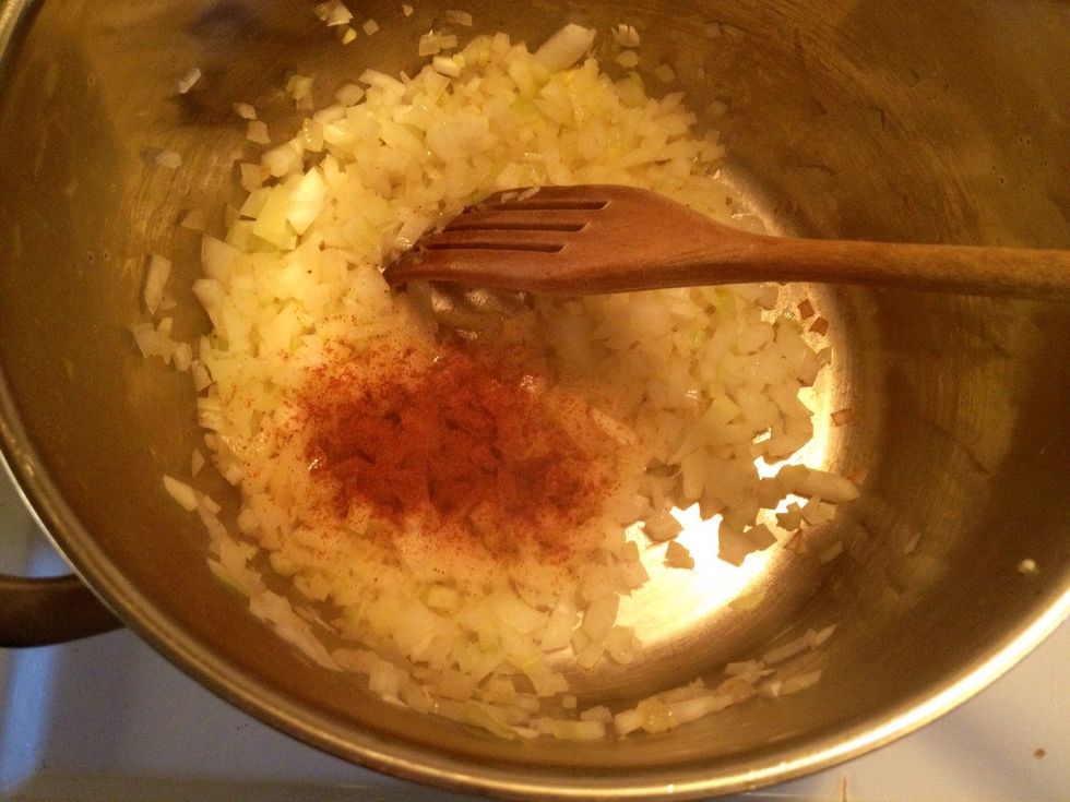 Fry the onions and the garlic with some paprika powder.