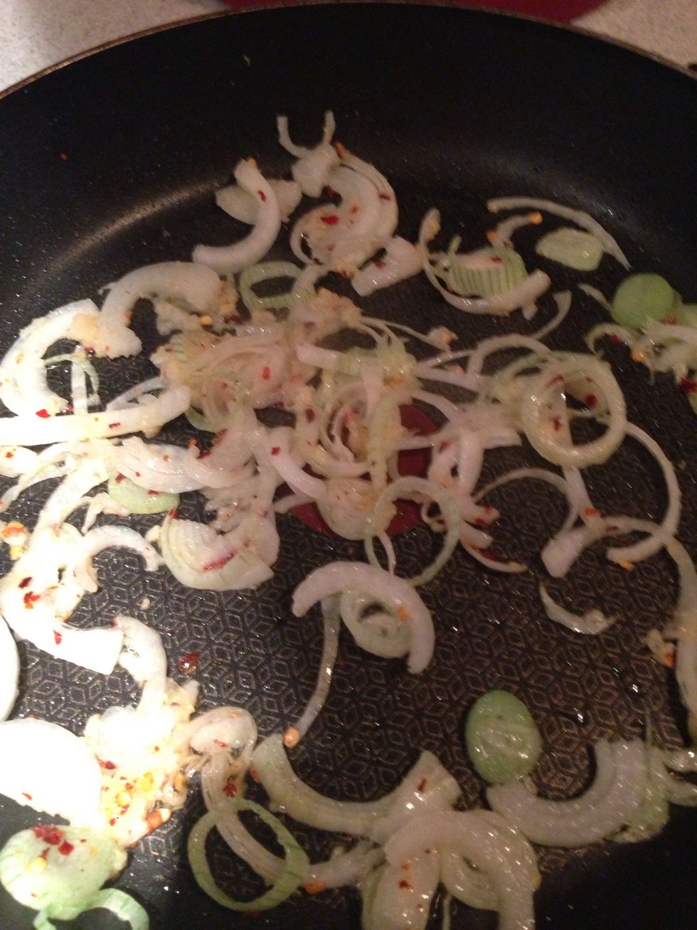 Fry the Onions, Garlic and Chili flakes over a medium heat for a minute until soft