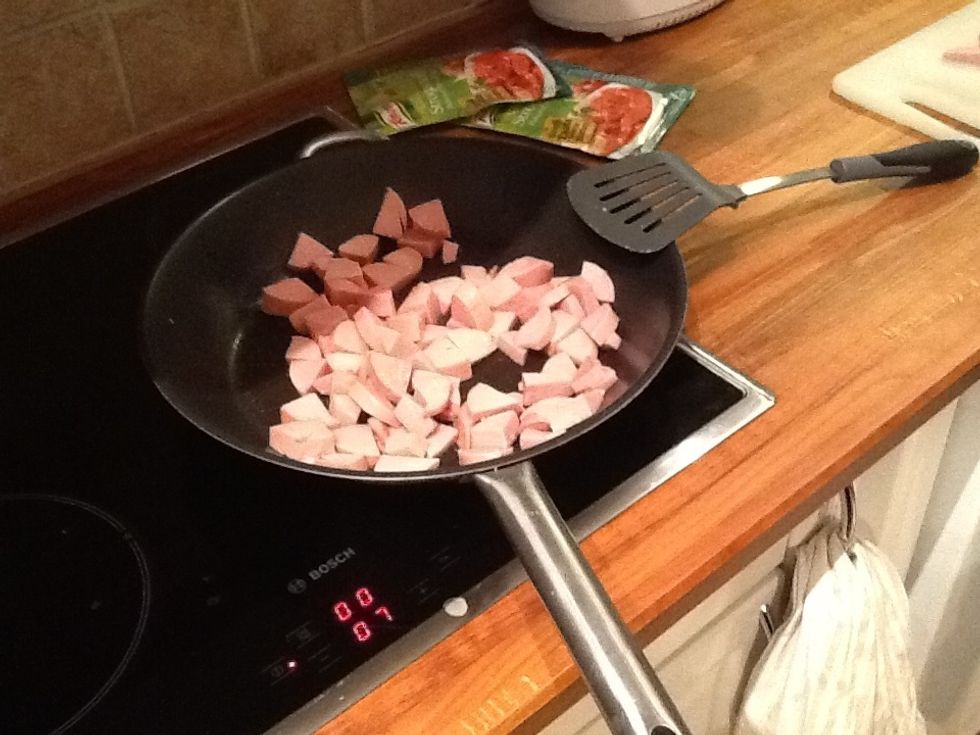 Fry the sausage until it's golden brown.