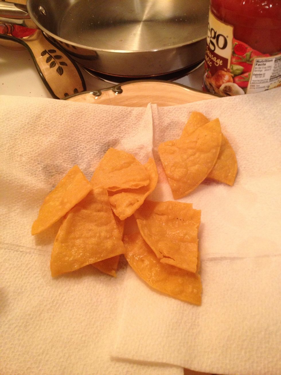 Fry until golden crisp. Take up and place on a plate with a paper towel to absorb the excess grease. Do the same for the remaining stacks if quarters.