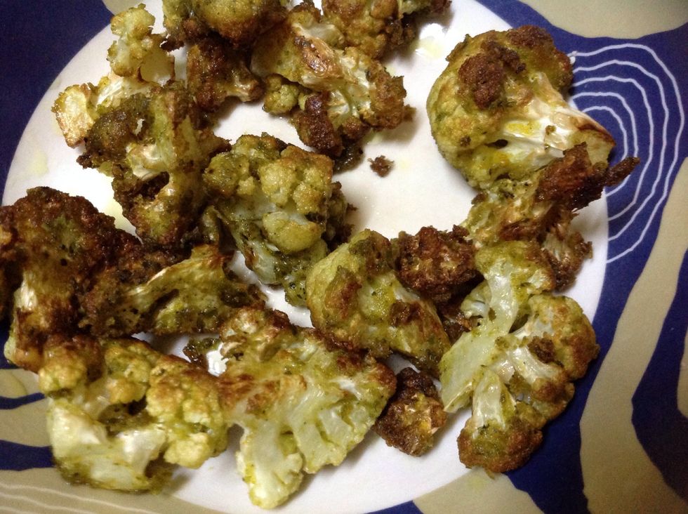 Fry until the cauliflower turns golden brown as shown.. Place it over tissue paper for draining excessive oil in the florets..